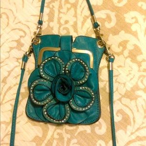 Small teal wristlet with over shoulder strap